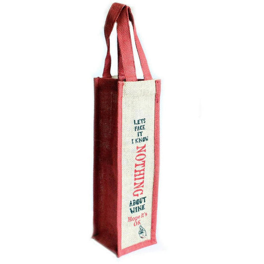 Red and beige jute wine bottle gift bag with the cheeky text I Know Nothing About Wine printed on the front.
