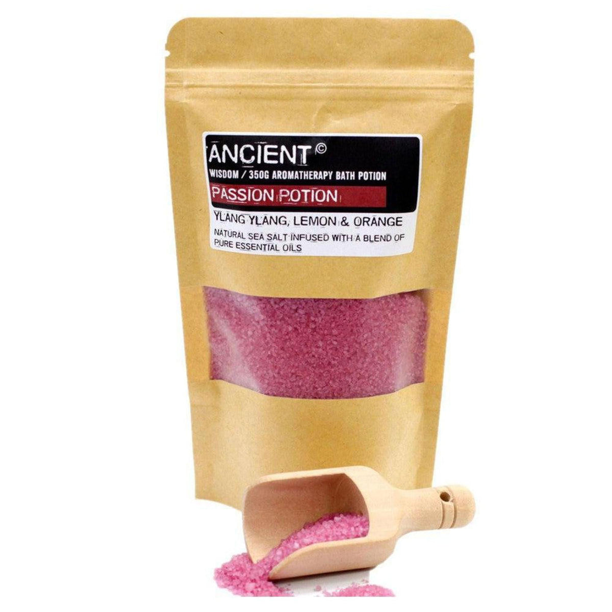 350g Passion Potion sea salt bath soak in a kraft pouch with a small wooden scoop of pink crystals.