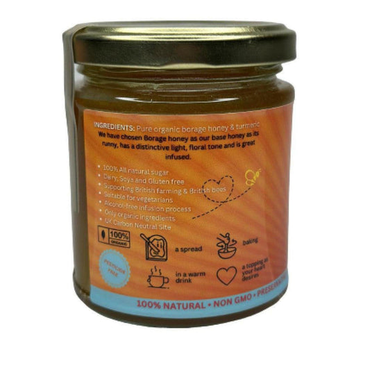 Glass jar of turmeric infused borage honey with an orange label detailing organic ingredients and usage icons.