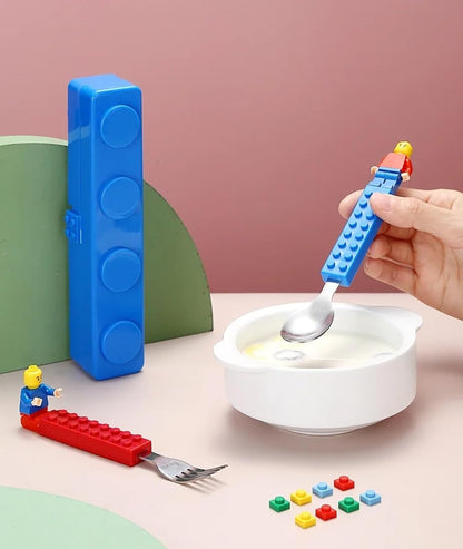 Kids Interlocking Cutlery Set - Stackable LEGO Style Fork - Spoon - Make mealtime magical with our Snack - Stack cutlery. Durable stainless steel, interlocking handles, and a portable case for joyful eating on the go. Buy Now at Sacred Remedy