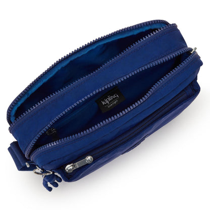Kipling Abanu Mini Crossbody | Deep Sky Blue Handbag - Shop the Kipling Abanu Mini Crossbody in Deep Sky Blue. Versatile, water-resistant nylon bag with multiple zipped compartments for easy organization and comfort Buy Now at Sacred Remedy