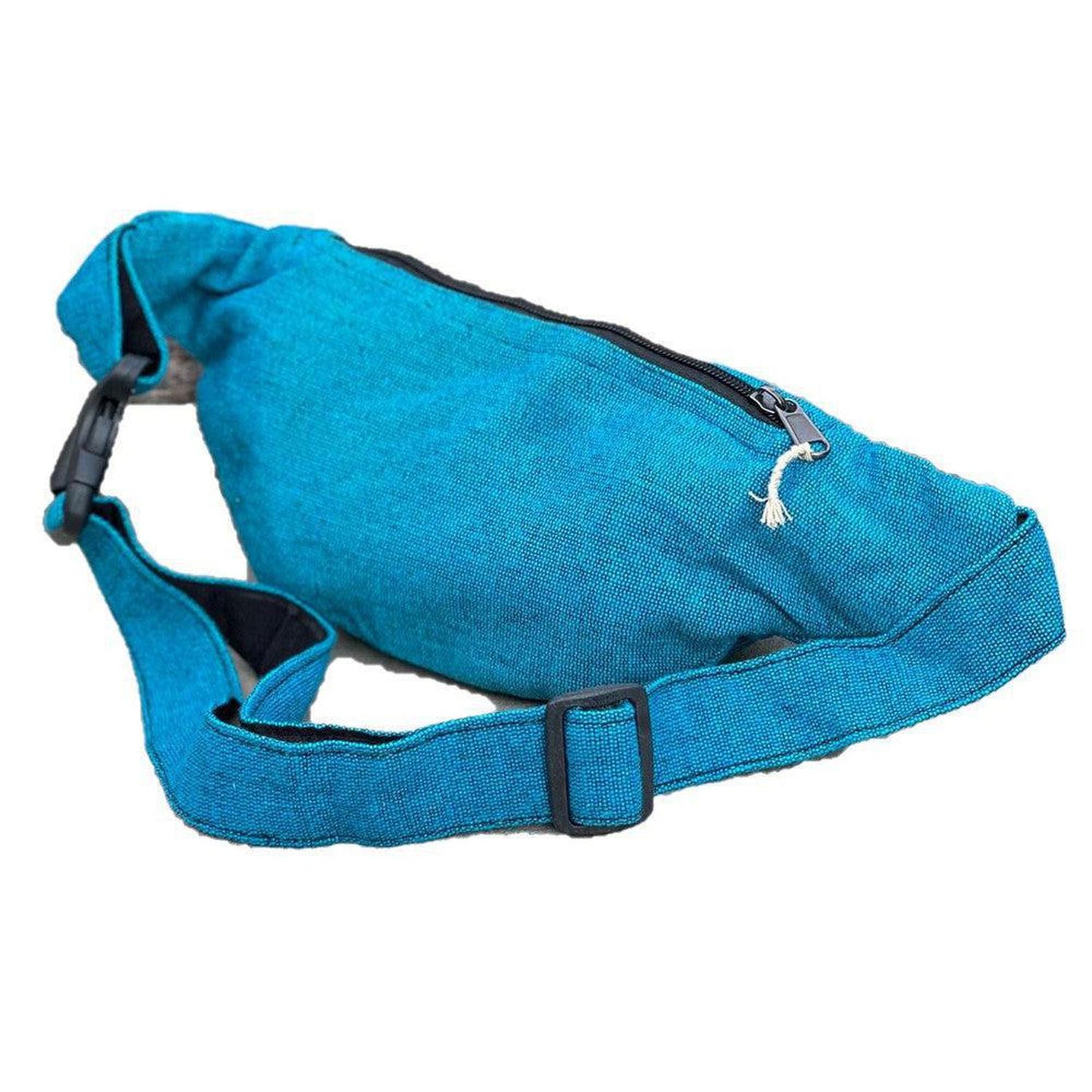 Eco-Friendly Boho Hippie Style Hemp Fanny Pack Hip Waist Bag: Turquoise Blue - Made in Nepal from high-quality, sustainable hemp fabric, our fanny packs are not only durable but also environmentally friendly. Perfect for all your essentials – phone, wallet, keys, passport, etc. Great gift for your loved ones who enjoy activities like travelling, walking, running, hiking, biking, camping etc. Buy Now at Sacred Remedy