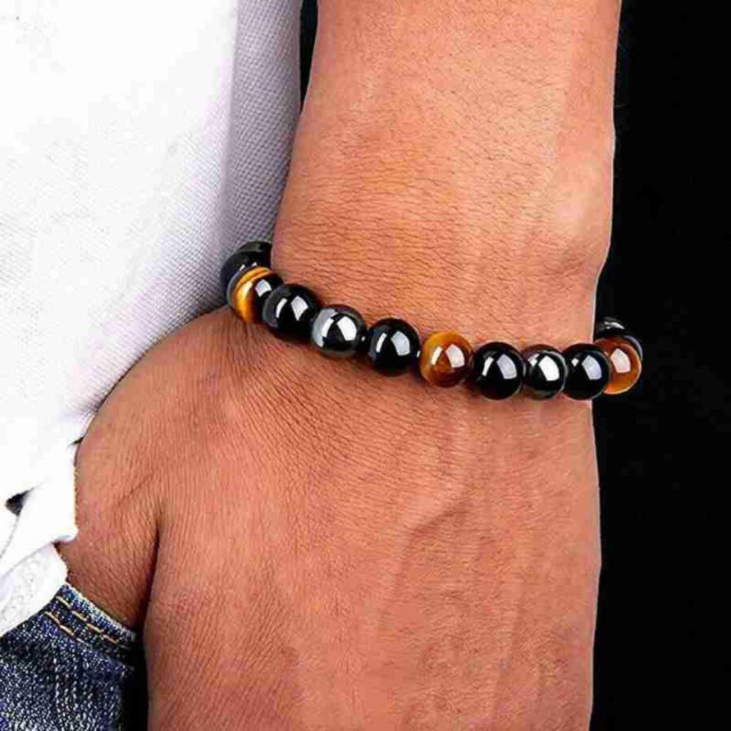 Triple Protection Bracelet - Tiger's Eye, Obsidian & Hematite - Unisex Triple Protection Bracelet featuring Tiger's Eye, Obsidian & Hematite. Shields against negative energy, provides EMF protection & boosts strength. Buy Now at Sacred Remedy