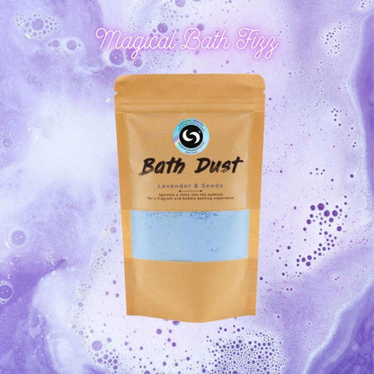 Lavender and Seeds bath dust in a tan pouch against a background of swirling purple, bubbly bath water.