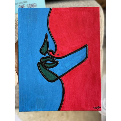 Abstract canvas art with cobalt blue and hot pink split-color blocking and a raised black tactile facial silhouette.