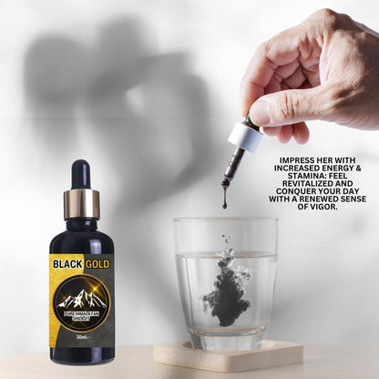 Black Gold Himalayan Shilajit liquid drops in a 30ml glass dropper bottle, with dark extract dissolving into a water glass.