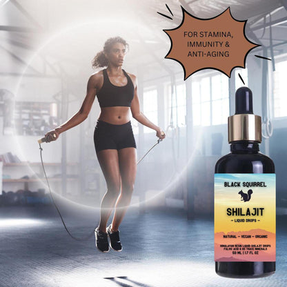 Black Squirrel 50ml Shilajit liquid drops bottle next to a woman jumping rope in a gym for stamina and vitality.