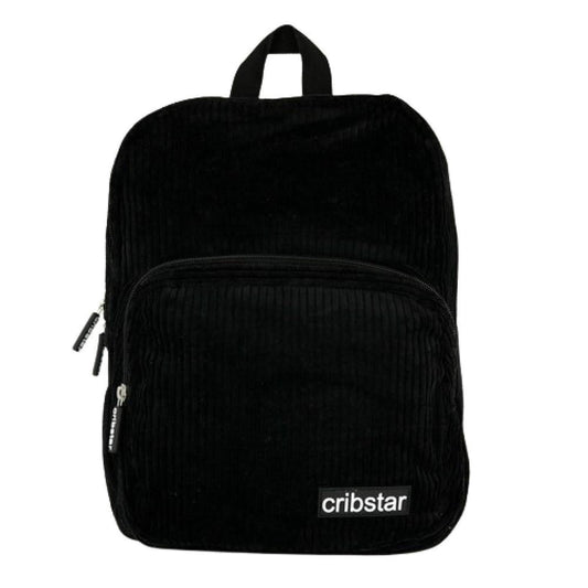 Compact black corduroy backpack with a front zip pocket, top handle, and white Cribstar logo patch on a white background.