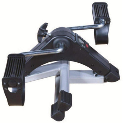 Black and silver portable pedal exerciser with adjustable resistance knob and digital display for arm and leg workouts.