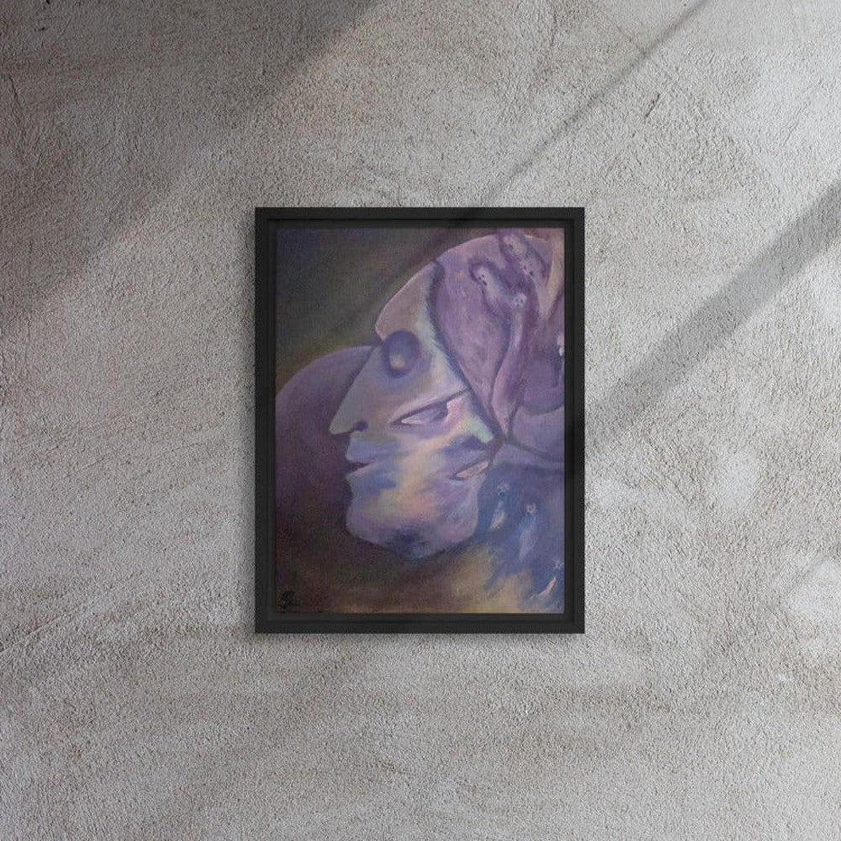 Surrealist painting in a black frame featuring interweaving faces in shades of midnight blue and purple on a textured wall.