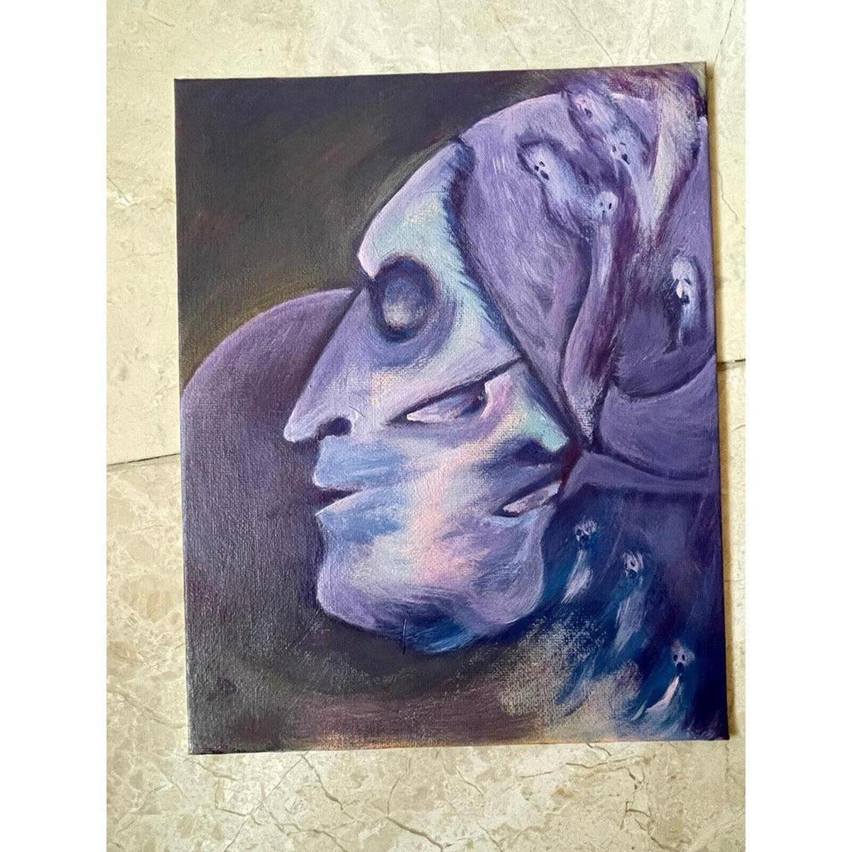Surrealist oil painting featuring interweaving faces in shades of midnight blue, purple, and lilac on canvas.