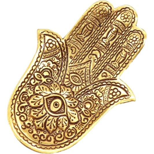 Polished gold aluminum Hamsa hand incense holder with intricate bohemian engravings and a central eye design.