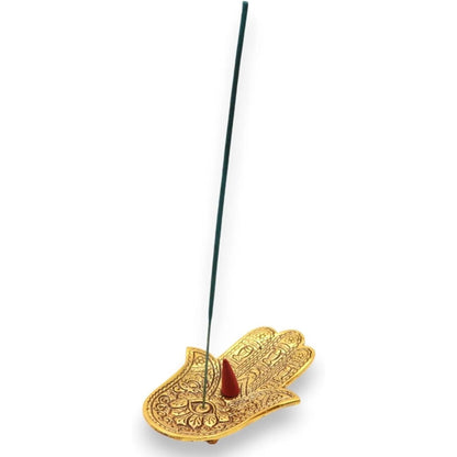 Polished gold aluminum Hamsa hand incense holder with intricate engravings, holding a stick and cone incense.