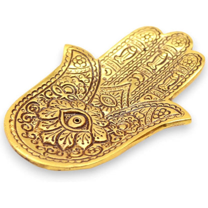Polished gold aluminum Hamsa hand incense holder with intricate engraved bohemian patterns, 13cm long.