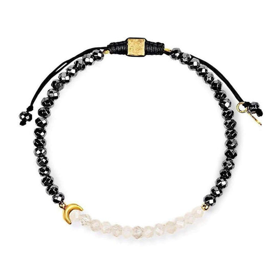 Hematite and moonstone beaded bracelet with a gold crescent moon charm and adjustable black cord.