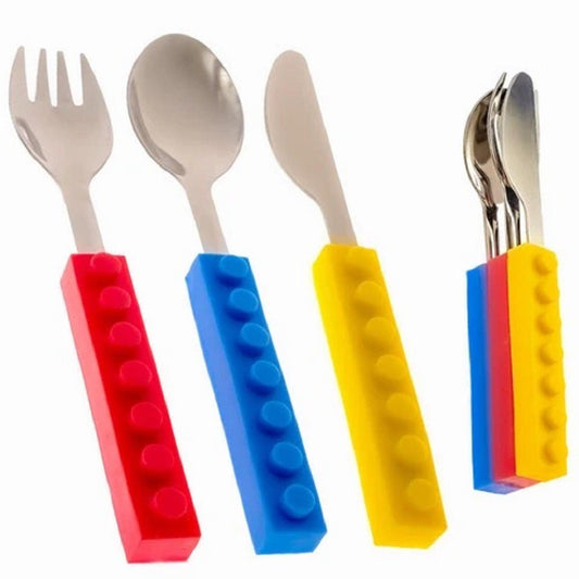 Three-piece kids' stainless steel cutlery set with red, blue, and yellow silicone building block handles that interlock.
