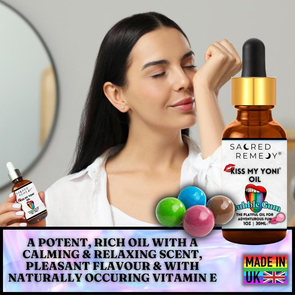 Woman smelling Kiss My Yoni Oil bubblegum scent in an amber dropper bottle with colorful gumballs on a branded background.