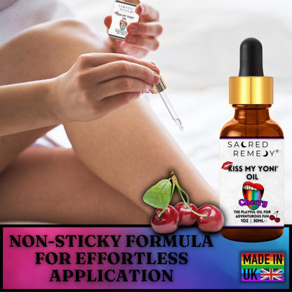Amber glass dropper bottle of Kiss My Yoni Cherry oil with a label featuring red lips and fresh cherries.