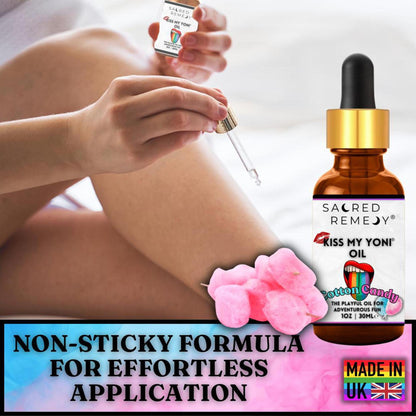 Amber glass dropper bottle of Sacred Remedy Cotton Candy Yoni Oil with pink cotton candy and a person applying the oil.
