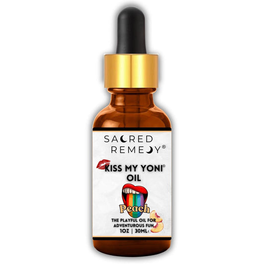30ml amber glass dropper bottle of Kiss My Yoni Peach oil with a white label featuring a rainbow tongue graphic.