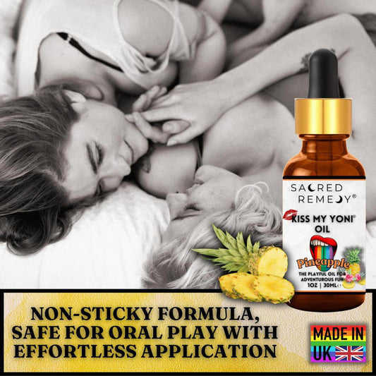 Amber glass dropper bottle of Kiss My Yoni Pineapple oil next to a couple, featuring a label with pineapple and lip graphics.