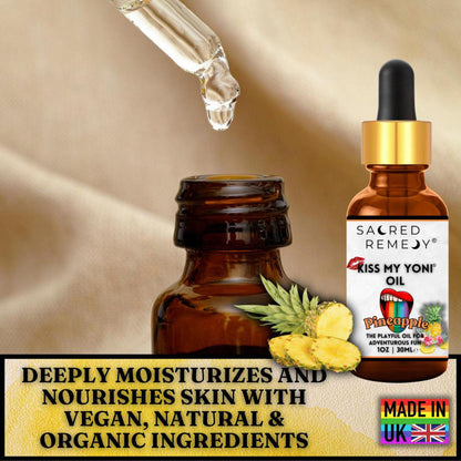 Amber glass dropper bottle of Kiss My Yoni Pineapple oil with fresh pineapple slices on a soft beige background.