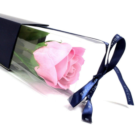 Large pink soap rose in a clear gift box, tied with a navy blue ribbon printed with the words Special For You.