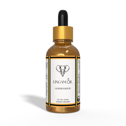 Amber glass dropper bottle of Golden Hour organic lingam oil with a gold cap and elephant logo label.