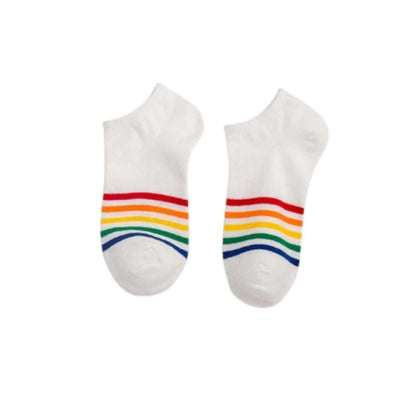 White cotton ankle socks featuring vibrant rainbow stripes across the toes, isolated on a white background.