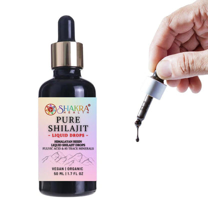 50ml bottle of Shakra Health Pure Shilajit liquid drops with a hand holding a dark resin dropper against a white background.
