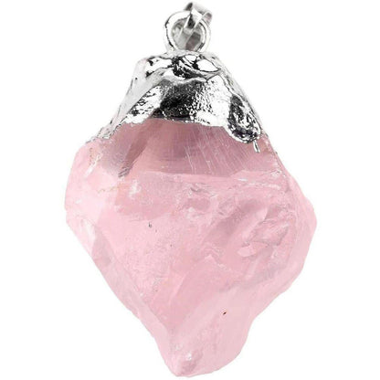 Raw, irregular pale pink rose quartz pendant with a silver cap bail on a white background.