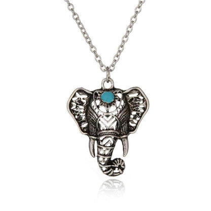 Antique silver-plated elephant pendant necklace featuring intricate filigree details and a central mystic blue stone.
