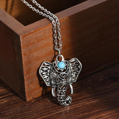 Antique silver-plated elephant pendant necklace featuring a central mystic blue stone on a delicate chain.
