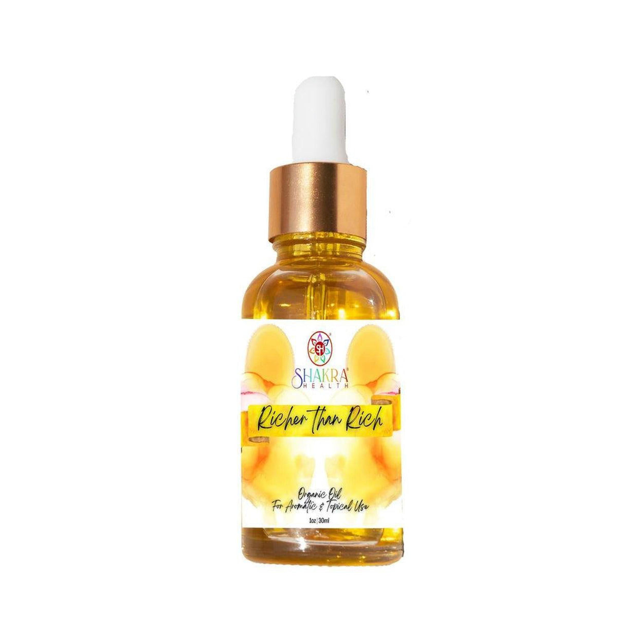 Amber glass dropper bottle of Richer Than Rich ritual oil with a gold cap and botanical label containing real currency.
