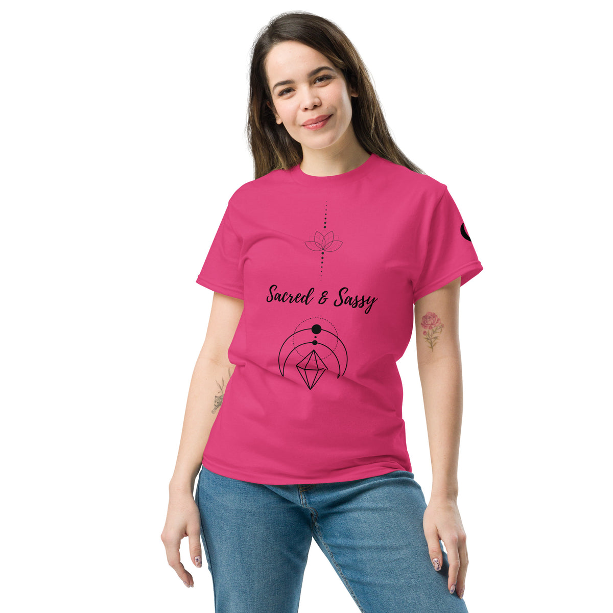 Woman wearing a bright pink cotton unisex t-shirt featuring a black lotus and geometric graphic design.