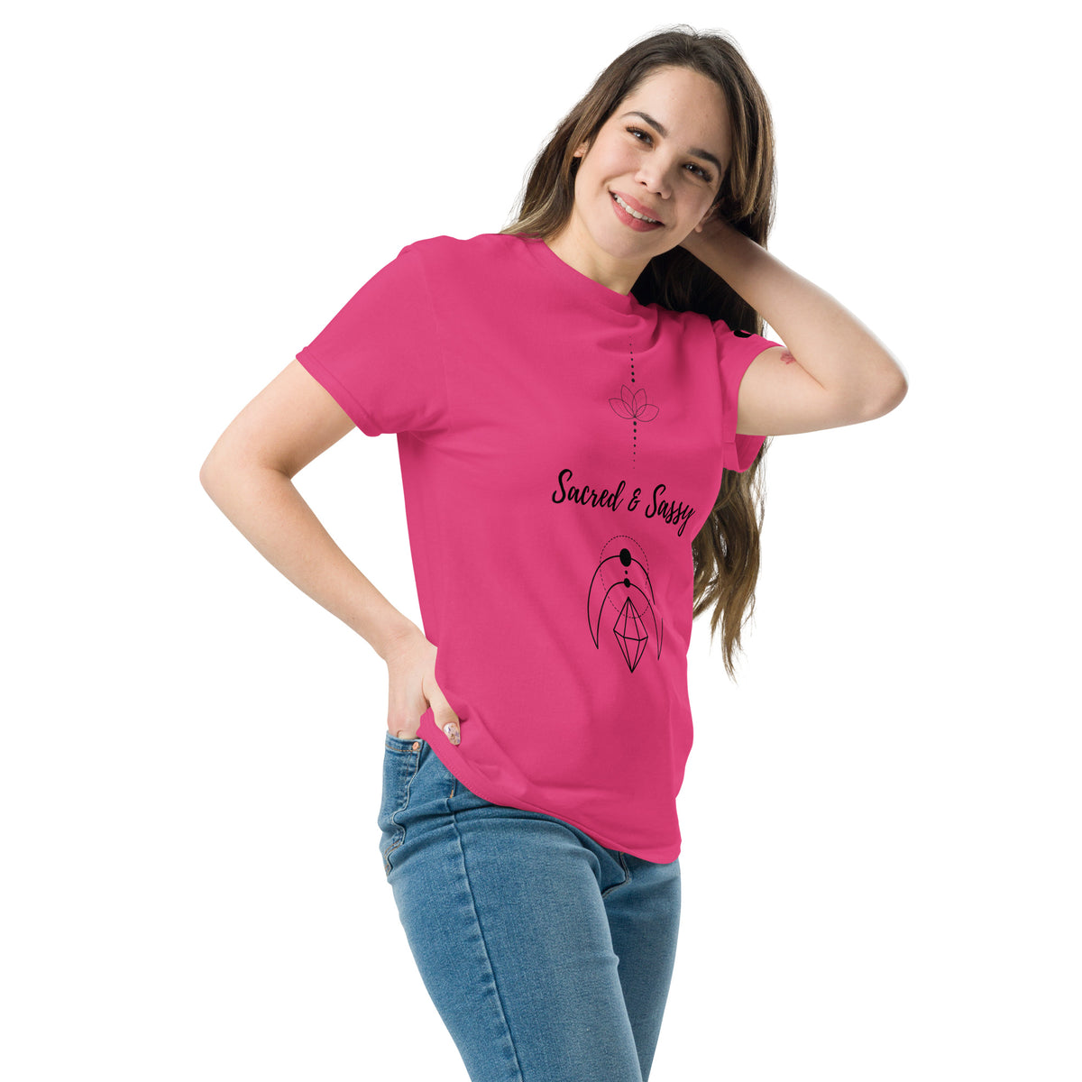 Woman wearing a vibrant pink cotton unisex t-shirt featuring a black Sacred & Sassy lotus graphic design.