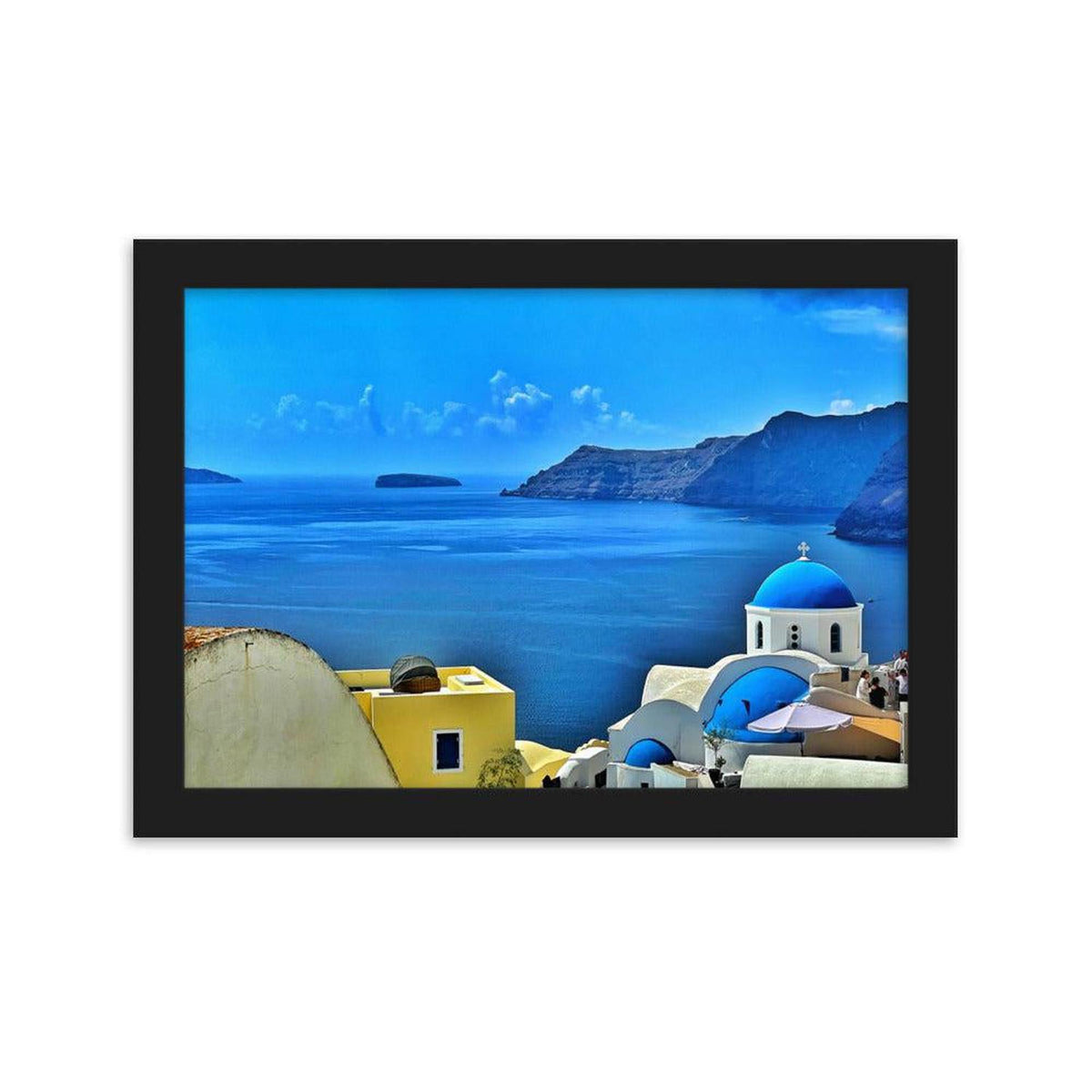Framed Santorini landscape print featuring blue-domed architecture and yellow buildings overlooking the Aegean Sea.
