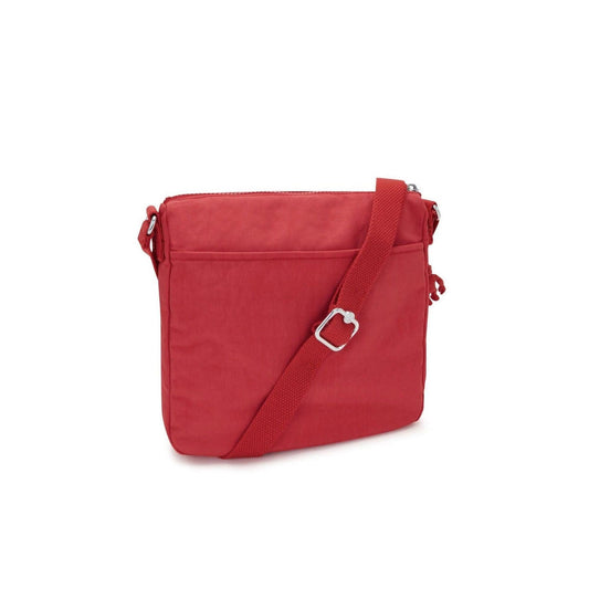 Kipling Sebastian medium crossbody bag in vibrant party pink with an adjustable shoulder strap and silver hardware.