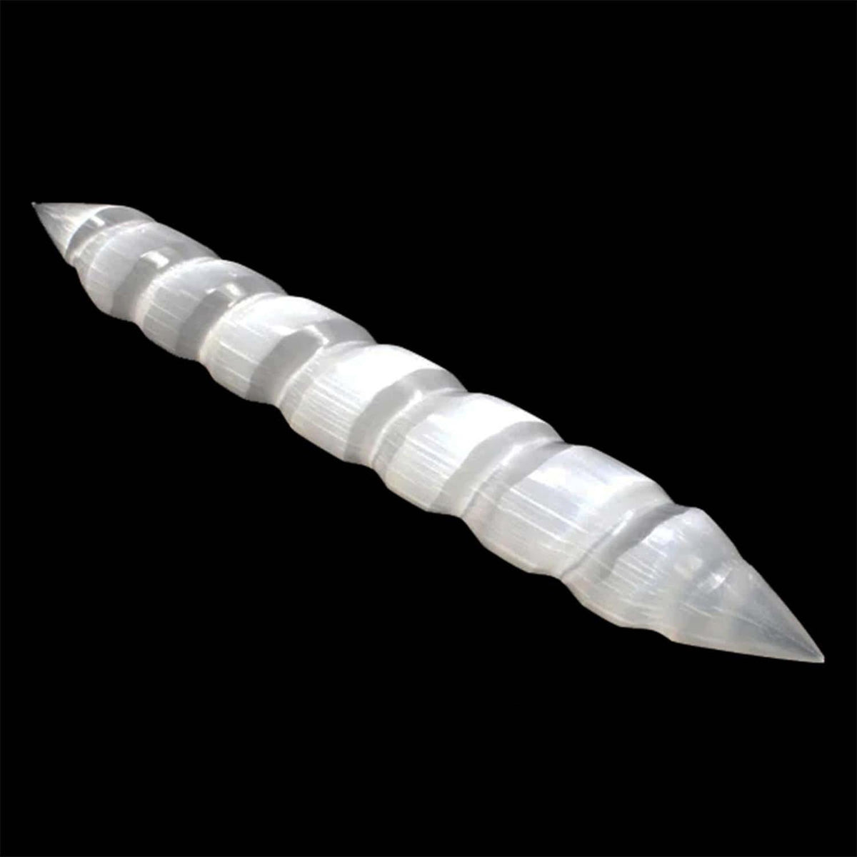 Milky white selenite massage wand with a spiral design and double pointed ends against a black background.