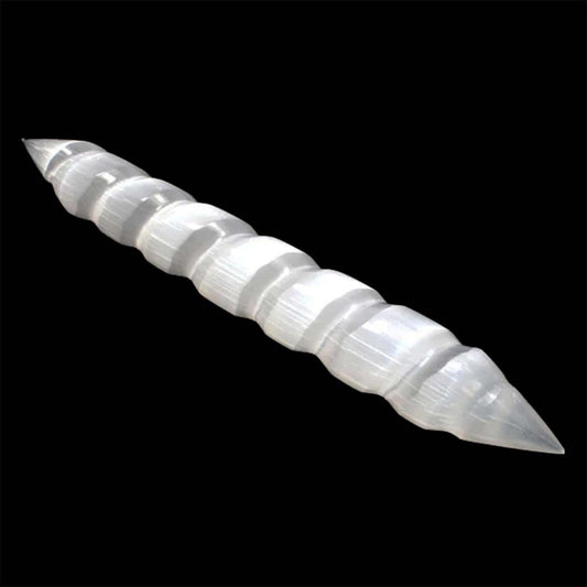 Milky white selenite massage wand with a spiral design and double pointed ends against a black background.