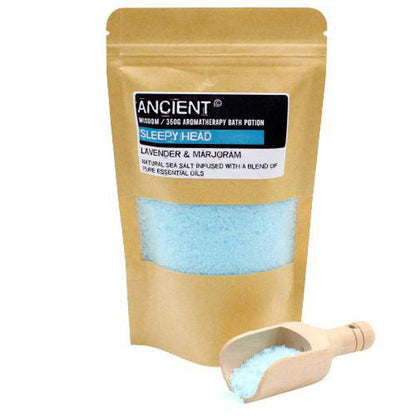 350g Sleepy Head aromatherapy sea salt bath soak in a kraft pouch with a blue salt blend and a small wooden scoop.