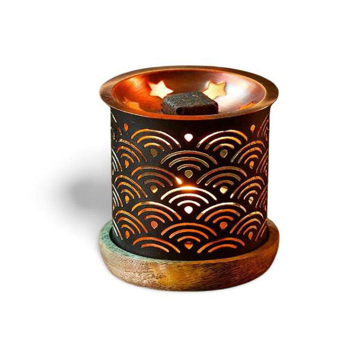 Black metal incense burner with wave cutouts, copper top, and wooden base holding a square aromatic brick.