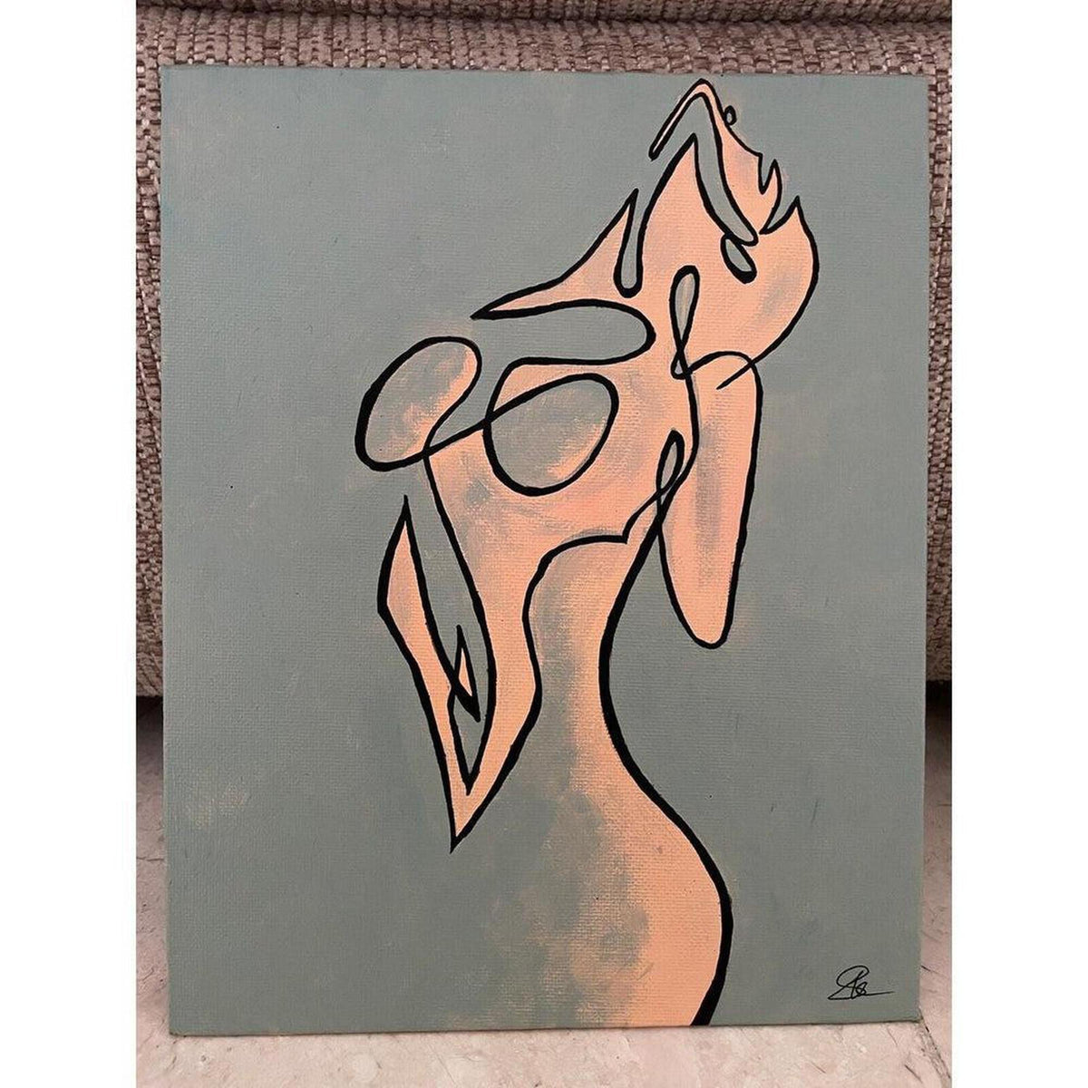 Contemporary line art painting of a feminine torso in peach and sage green, featuring bold black outlines on canvas.