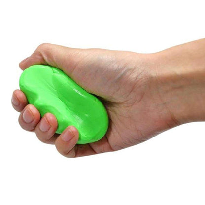 Hand squeezing a smooth, bright green therapy putty for hand strength, dexterity, and fine motor rehabilitation.