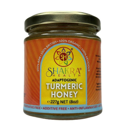 Glass jar of Shakra Health turmeric infused borage honey with a yellow label and gold lid, 227g net weight.