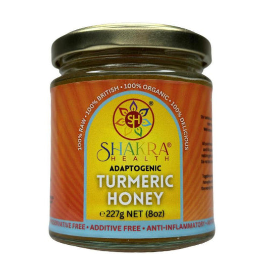 Glass jar of Shakra Health turmeric infused borage honey with a yellow label and gold lid, 227g net weight.