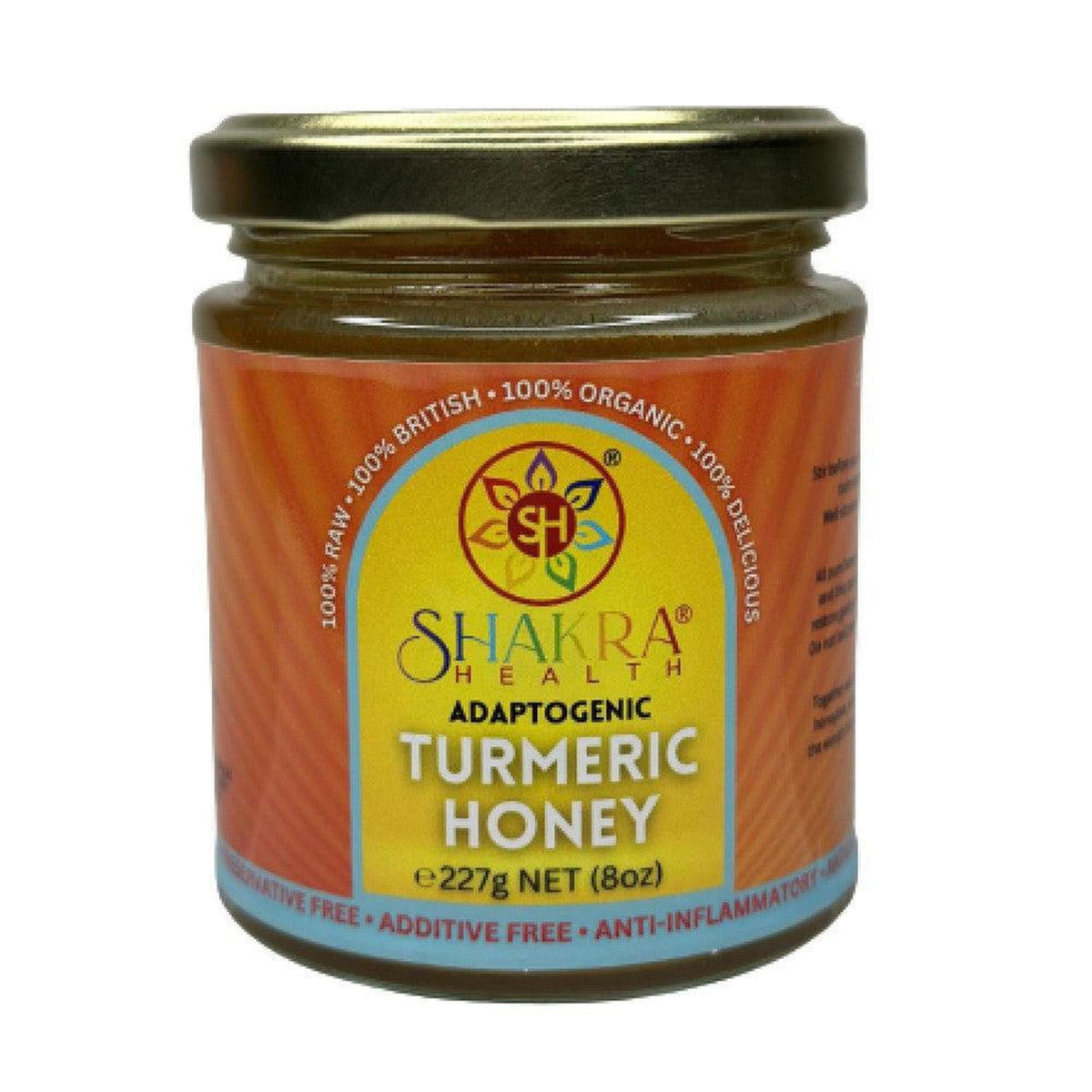 Glass jar of Shakra Health turmeric infused borage honey with an orange label and gold lid, 227g net weight.