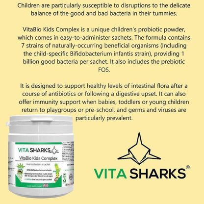 White plastic jar of VitaBio Kids Complex probiotic powder with green and blue label on a cream background.