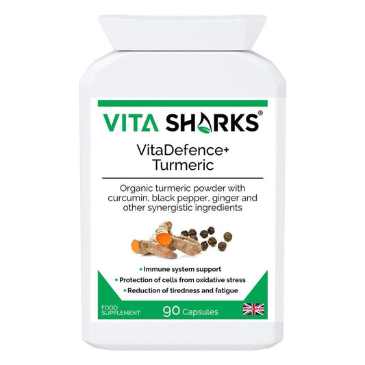 White bottle of VitaDefence+ Turmeric capsules with organic root and peppercorn imagery on the label.