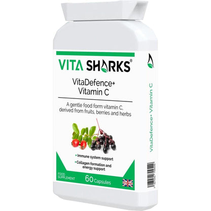 White bottle of VitaDefence+ Vitamin C capsules with green branding, fruit illustrations, and 60-capsule label.
